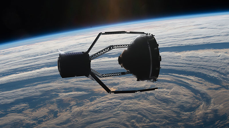 The ClearSpace-1 satellite (left) docking with a piece of space debris (right), before safely removing it from orbit. Image credit: ClearSpace SA.